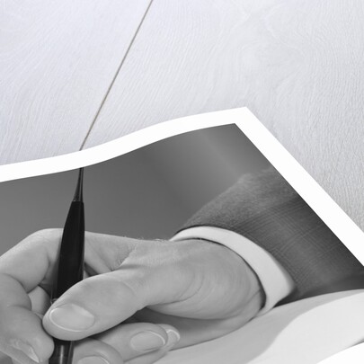 Male hand writing with fountain pen on blank paper by Anonymous