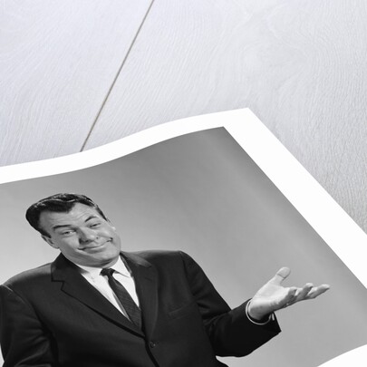 Business man shrugging his shoulders by Anonymous