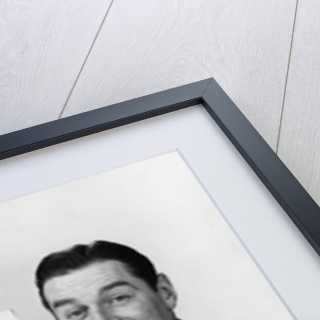 Smiling man pointing to blank poster sign by Anonymous