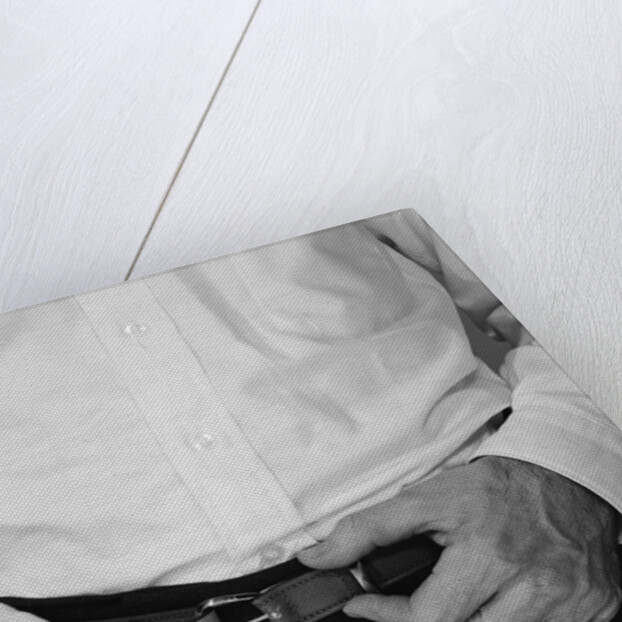 Man hands tightening belt by Anonymous