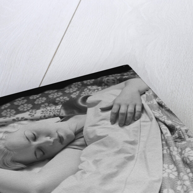 Sleeping blond woman hand over head asleep by Anonymous