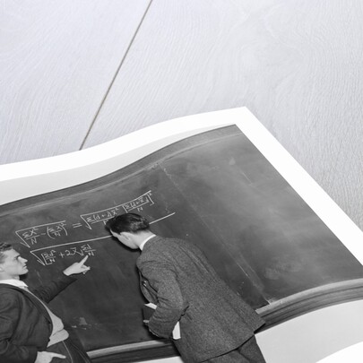 2 students professors mathematicians blackboard studying complex equations by Anonymous