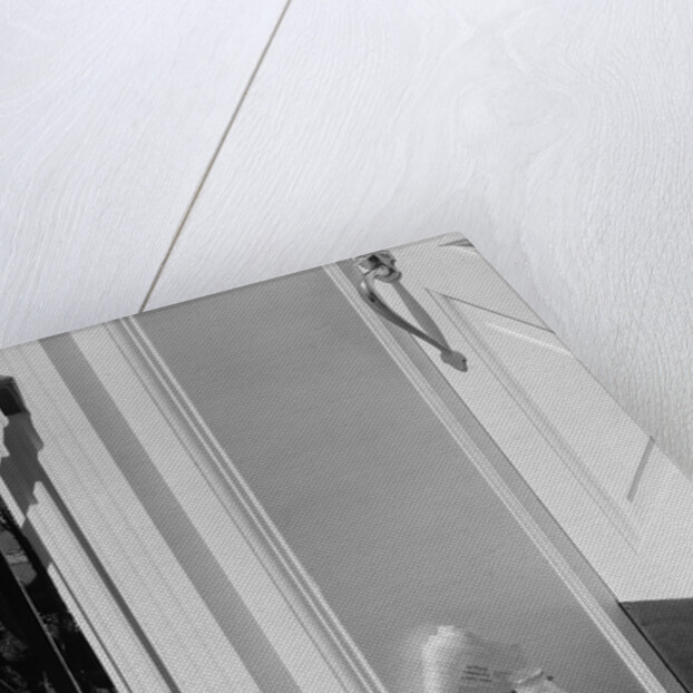 Glass milk bottles and newspaper by front door home delivery by Anonymous