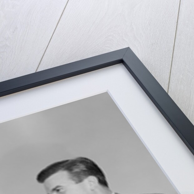 Older and younger business men shaking hands by Anonymous