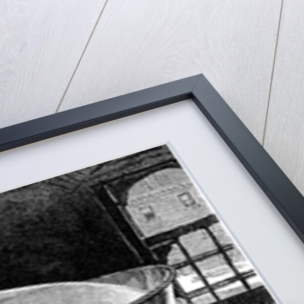 Brewer adding hops to boiling beer in an American brewery by Anonymous