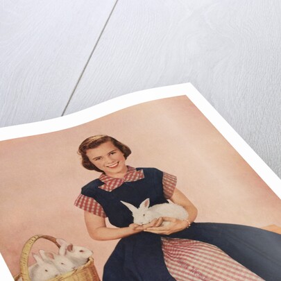 Girl holding rabbit by Anonymous
