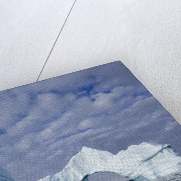 Arched iceberg in Disko Bay in Greenland by Anonymous