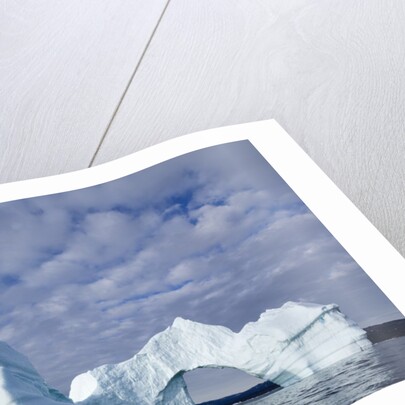Arched iceberg in Disko Bay in Greenland by Anonymous
