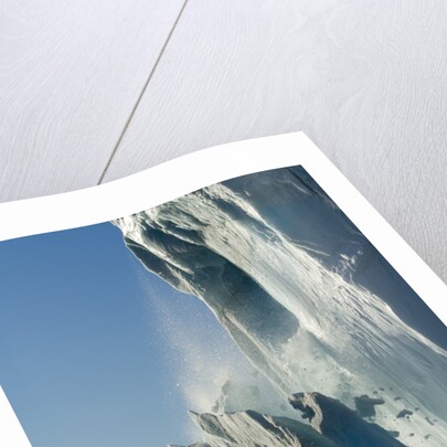 Calving iceberg in Disko Bay in Greenland by Anonymous