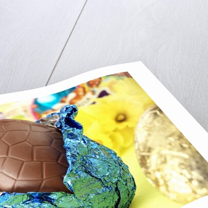 Chocolate Easter egg with opened foil by Anonymous