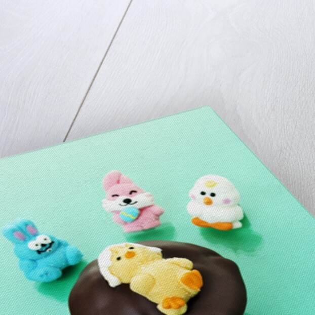 Muffin with chocolate icing and jelly chick for Easter by Anonymous