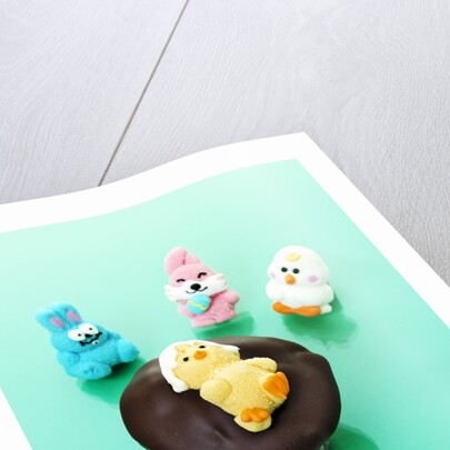 Muffin with chocolate icing and jelly chick for Easter by Anonymous