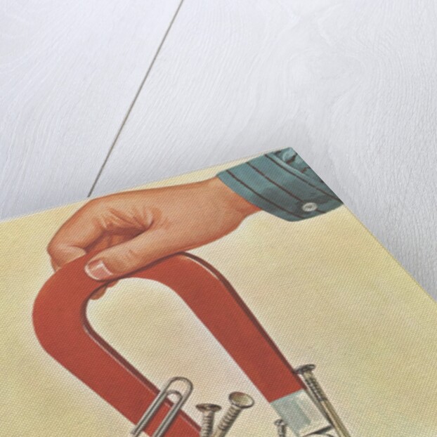 Metal objects sticking to magnet by Anonymous