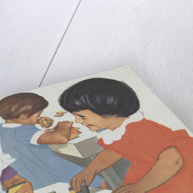 Girls playing with puzzles by Anonymous