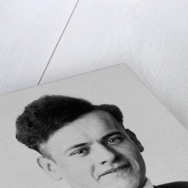 Young man smiles in a formal portrait, ca. 1920 by Anonymous