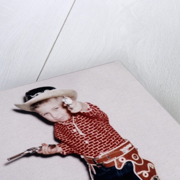 Little cowboy fires play six shooters, ca. 1956 by Anonymous