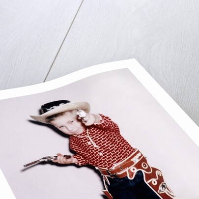 Little cowboy fires play six shooters, ca. 1956 by Anonymous