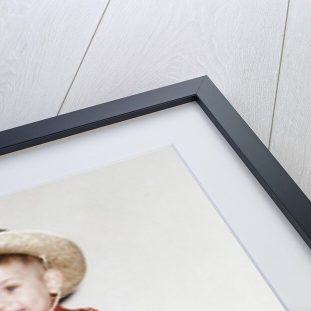 Little boy cowboy plays guitar while riding his horse, ca. 1956 by Anonymous