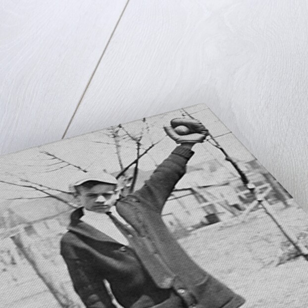 Teenage boy plays catch, ca. 1912 by Anonymous