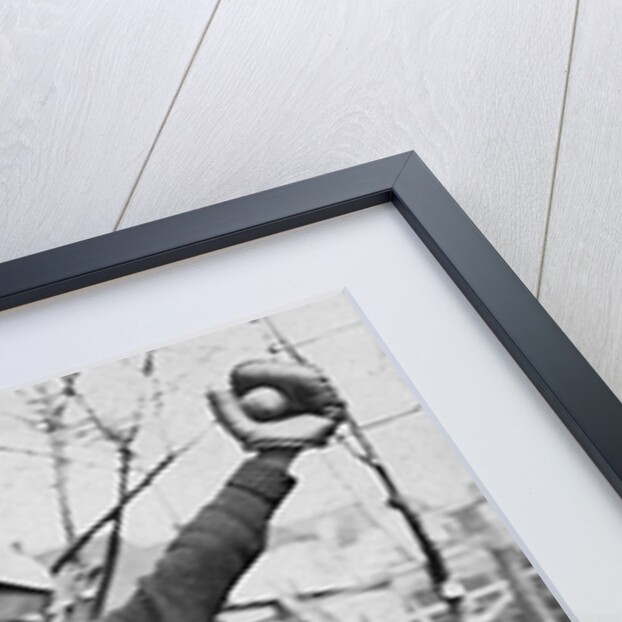 Teenage boy plays catch, ca. 1912 by Anonymous
