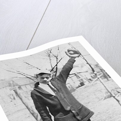 Teenage boy plays catch, ca. 1912 by Anonymous