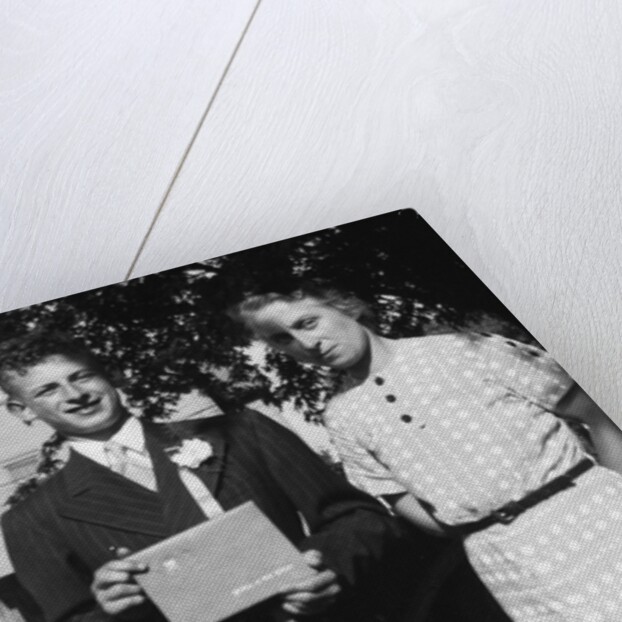 Boy with his parents on his 8th grade graduation, ca. 1940 by Anonymous