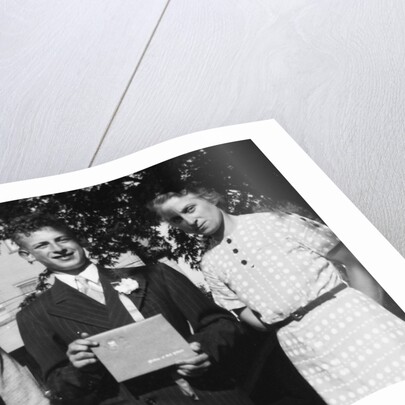Boy with his parents on his 8th grade graduation, ca. 1940 by Anonymous