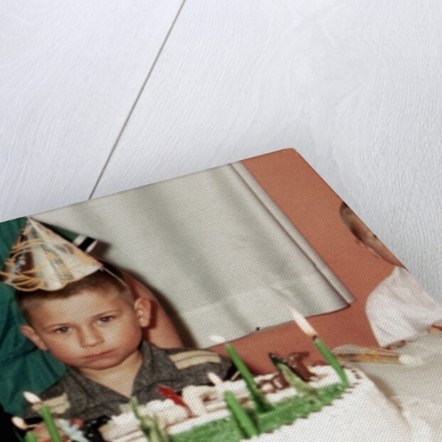 Grumpy boy at fifth birthday party, ca. 1957 by Anonymous