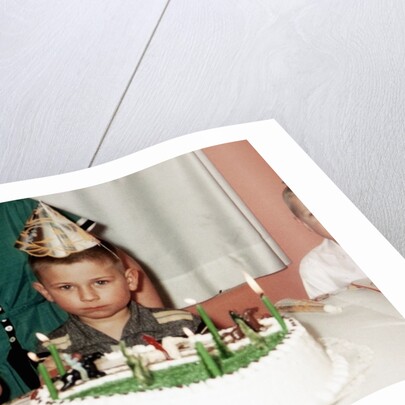 Grumpy boy at fifth birthday party, ca. 1957 by Anonymous