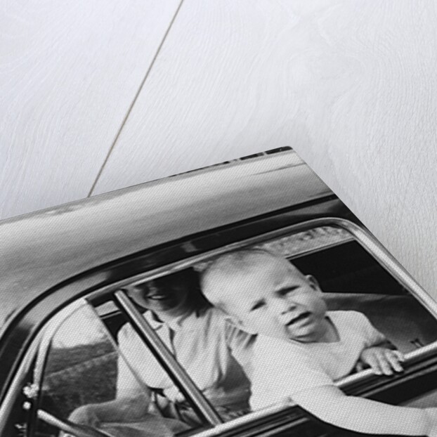Young boy hangs out of driver's side car window, ca. 1954 by Anonymous