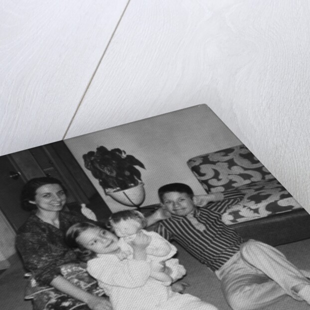 Mother with son and daughter in living room, ca. 1960 by Anonymous