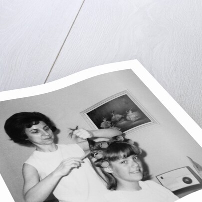 Mother helps 16 year old daughter get ready for date, ca. 1970 by Anonymous