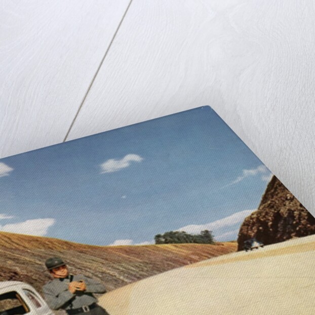 Policeman writing speeding ticket by Anonymous