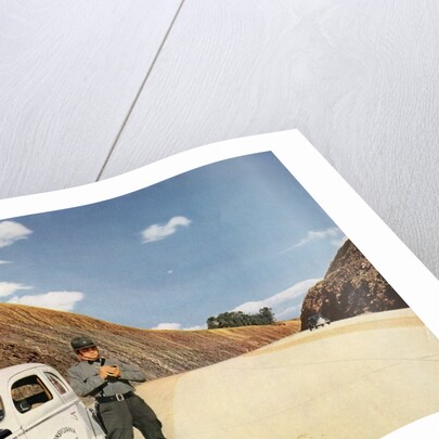 Policeman writing speeding ticket by Anonymous