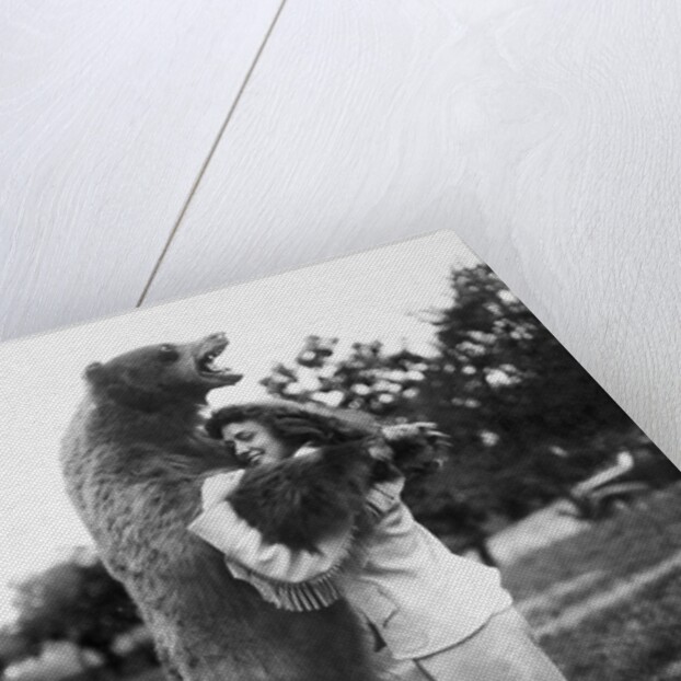 Woman embraces a stuffed bear, ca. 1940 by Anonymous