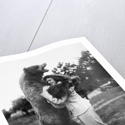 Woman embraces a stuffed bear, ca. 1940 by Anonymous