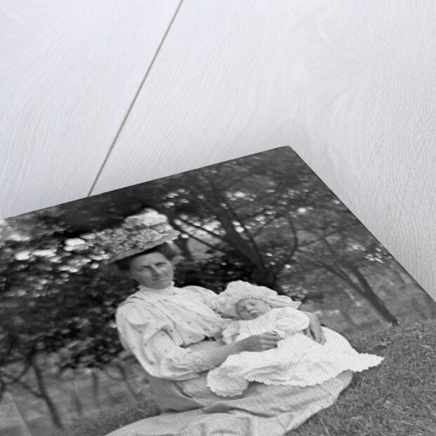 OIder woman and baby in a English park, ca. 1900. by Anonymous