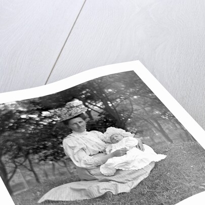OIder woman and baby in a English park, ca. 1900. by Anonymous