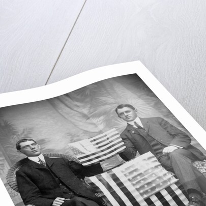 Two men pose with American flags, ca. 1895. by Anonymous