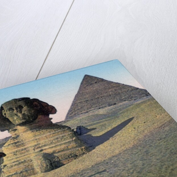 Men praying to Mecca in front of the Sphinx and pyramids by Anonymous