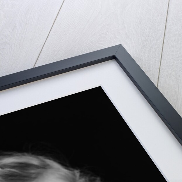 1940s little blond girl ribbon in hair holding tissue to nose sneezing by Anonymous