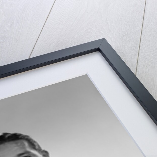 1960s man walking on crutches looking at camera by Anonymous