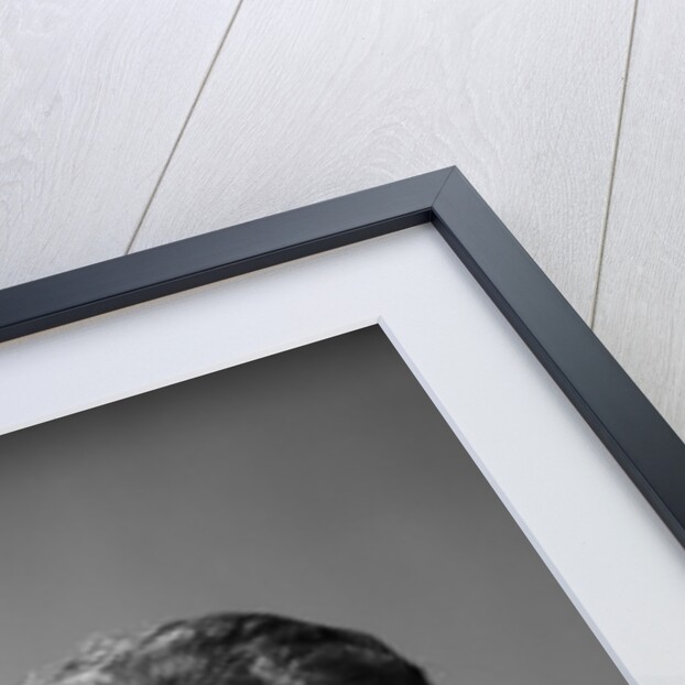 1950s housewife woman in print apron hand up to temple headache pain sad depressed facial expression worried serious looking at camera by Anonymous