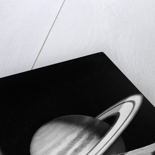 1960s space rocket flying past saturn with surface of another planet in foreground by Anonymous