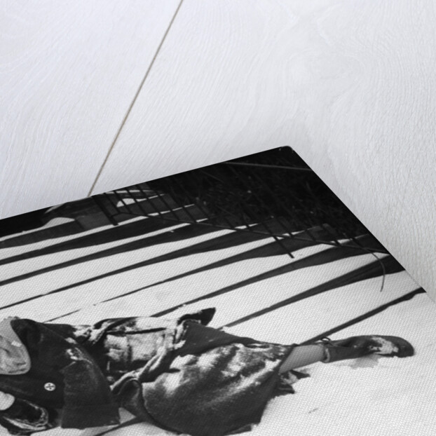 1950s woman lying on snow covered steps fall accident slip expression of pain by Anonymous