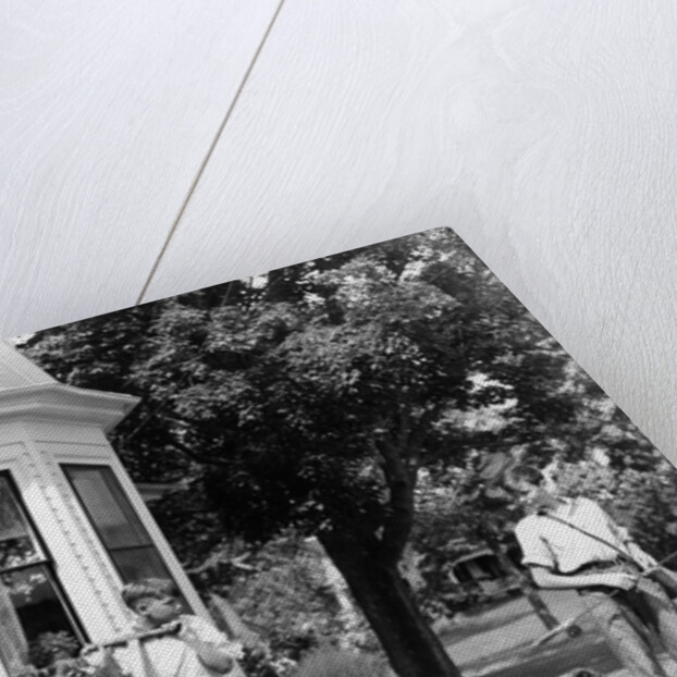 1940s boy with fishing gear collie dog second boy mowing grass with push mower by Anonymous