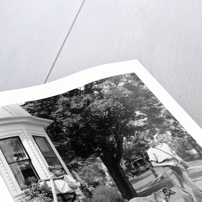 1940s boy with fishing gear collie dog second boy mowing grass with push mower by Anonymous