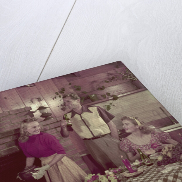 1950s 2 couples cooking picnic in rustic kitchen drinking beer by Anonymous