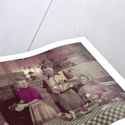 1950s 2 couples cooking picnic in rustic kitchen drinking beer by Anonymous