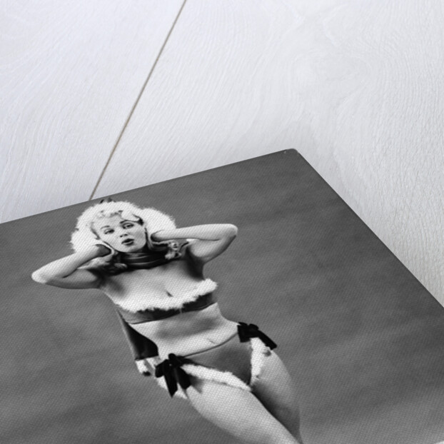 1950s young woman standing inside wearing fur trimmed bikini and gloves by Anonymous